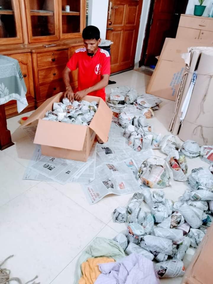 a man packing glass materials