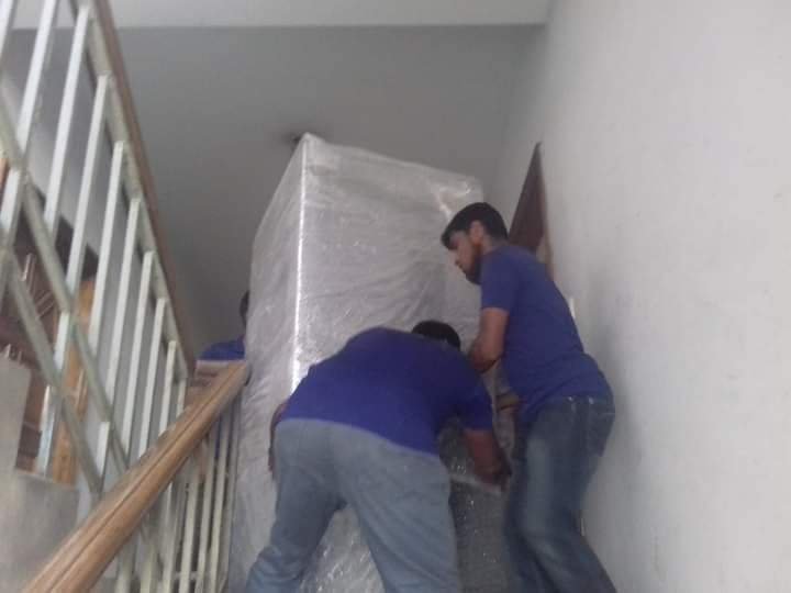 two man moving a package