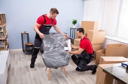 two man packing a chair